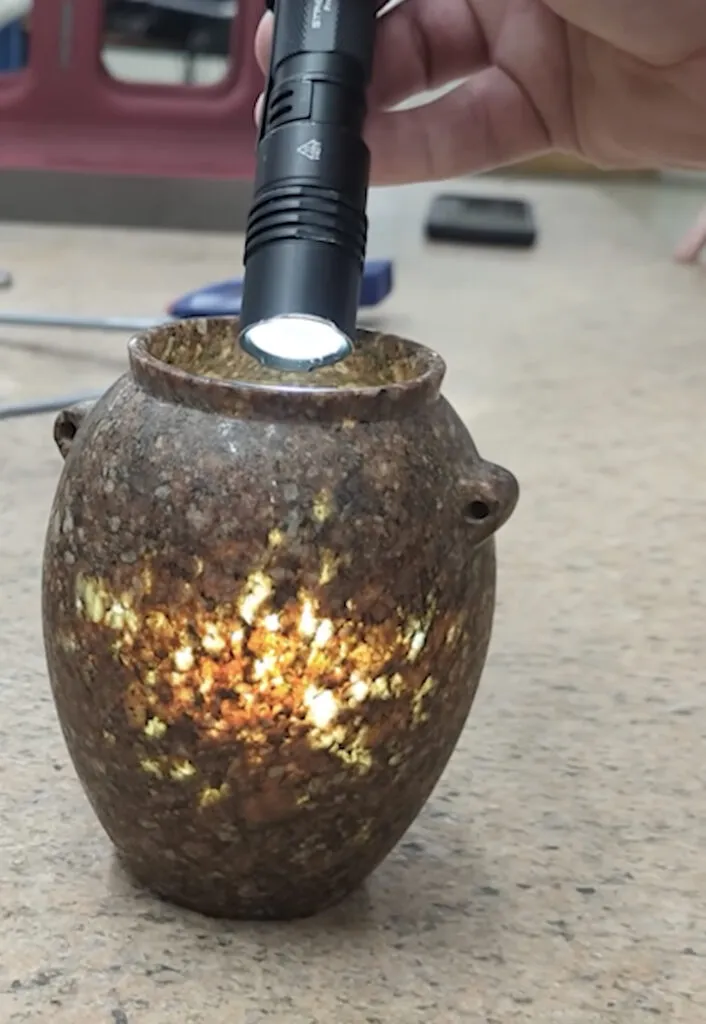 Pre-dynastic Egyptian granite vessel, so thin that it lets torchlight pass through it.